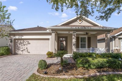 Exterior Front of home w/ concrete landscape bordering & a 13' x 8' front porch | Image 1