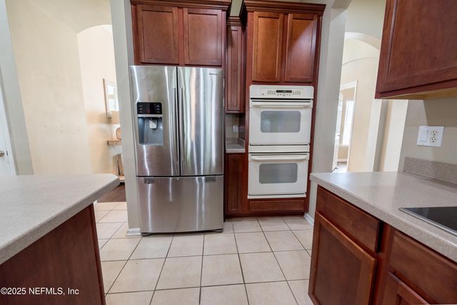 11760 Huckleberry Trl E, House other with 4 bedrooms, 2 bathrooms and null parking in MACCLENNY FL | Image 12
