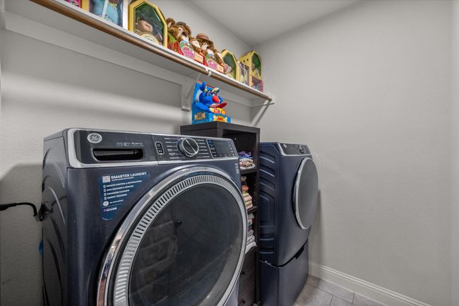 Laundry room and tile patterned floors | Image 18