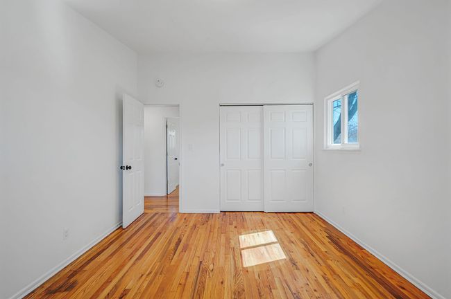 Room featuring plenty of natural light, baseboards, light wood-type flooring, and visible vents | Image 11