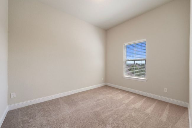 Spare room with light carpet and baseboards | Image 25