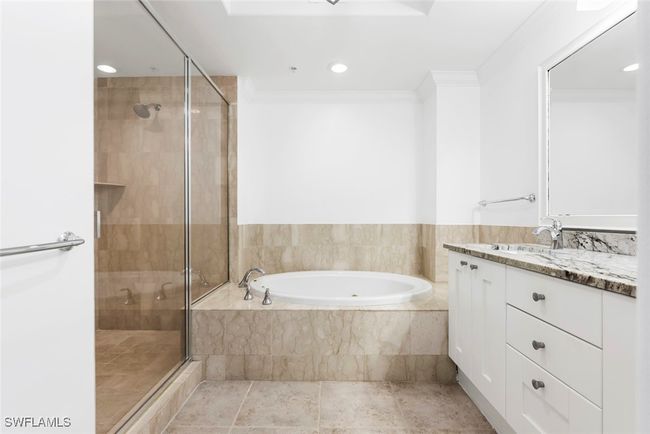 Bathroom with vanity, crown molding, independent shower and bath, and tile patterned floors | Image 11