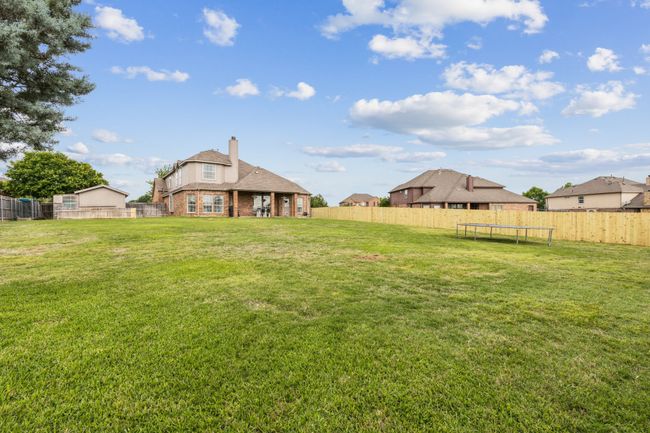 View of yard with a fenced backyard and a trampoline | Image 30