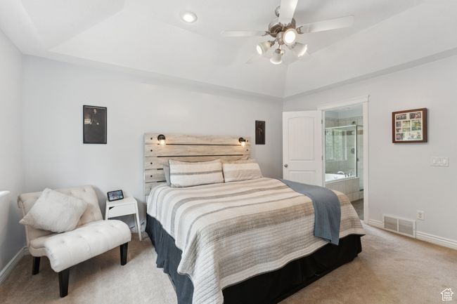 Bedroom featuring carpet flooring, baseboards, ensuite bath, and a ceiling fan | Image 14