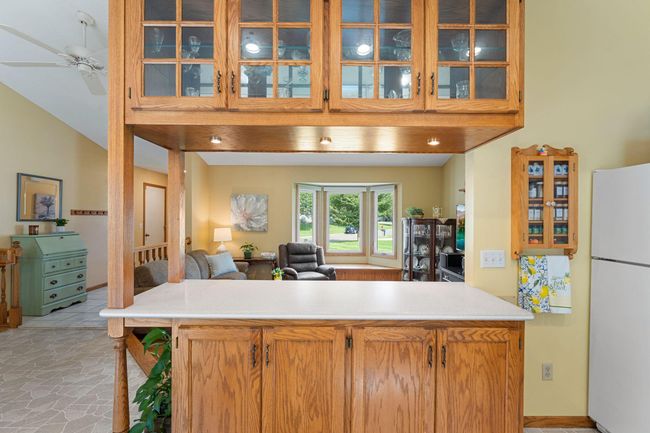 This custom island and built ins offer convenience and beauty. | Image 13