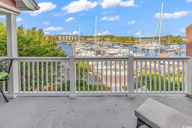 Balcony with a boat dock and a water view | Image 32