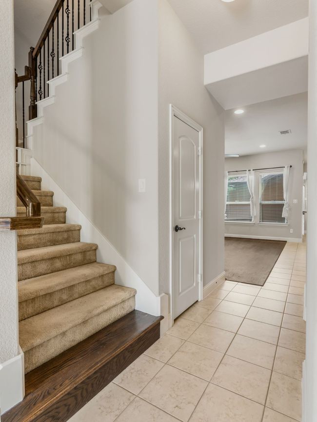 Stairs featuring tile patterned flooring and recessed lighting | Image 9
