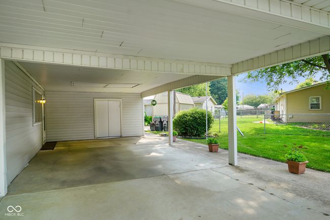view of patio featuring a residential view and an attached carport | Image 9