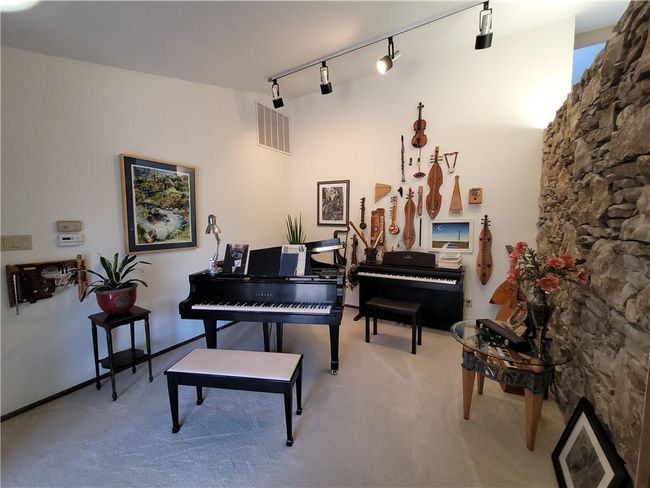 Sitting room featuring rail lighting, carpet floors, and visible vents | Image 13