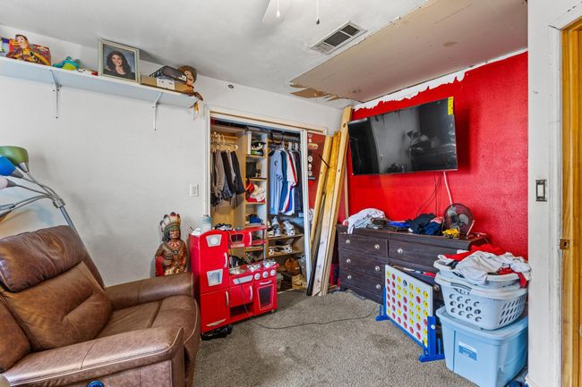 Carpeted bedroom with a closet and a ceiling fan | Image 16