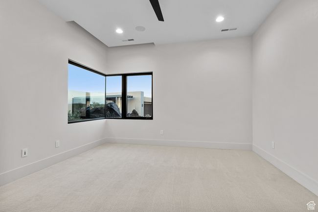 Unfurnished room with carpet floors, visible vents, baseboards, and ceiling fan | Image 45