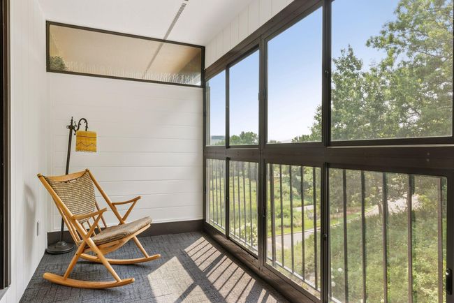 3-season porch with peaceful tree-lined views, perfect for relaxing or entertaining | Image 10