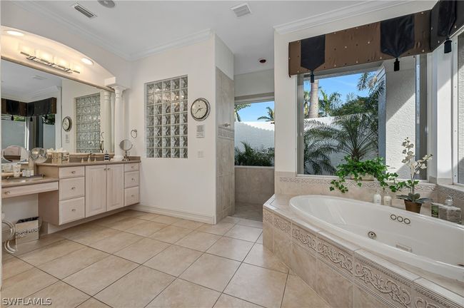 Primary Bath featuring separate water closet (with bidet), extra large closet, linen closet, double sinks, jetted tub and private shower overlooking hidden garden. | Image 23