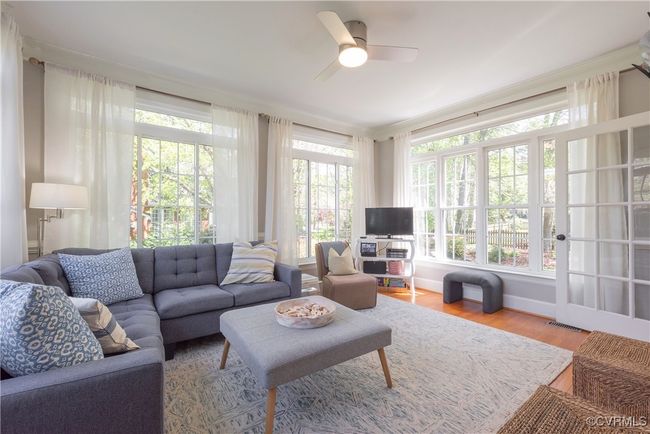Sunroom / solarium featuring wood finished floors and visible vents | Image 10