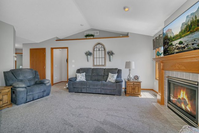 Large windows flood the room with natural light. | Image 15
