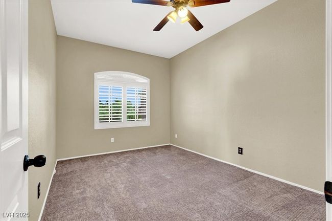Carpeted empty room featuring ceiling fan and baseboards | Image 29