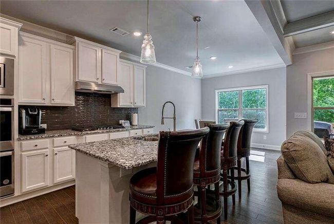 7059 Lancaster Xing, House other with 4 bedrooms, 3 bathrooms and 3 parking in Flowery Branch GA | Image 13