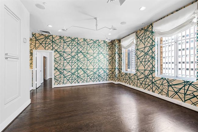 Beautiful hardwoods with sizable windows and Roman shades. | Image 4