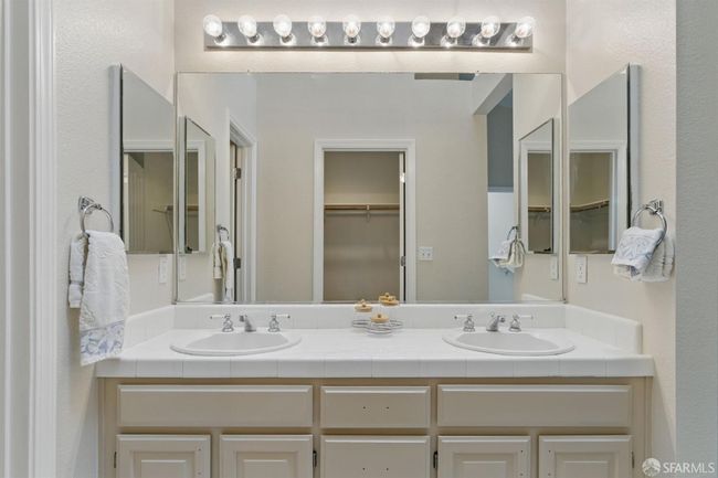 Walk-in closet directly opposite vanity area | Image 30
