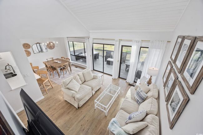 View from stairs looking into den area | Image 9