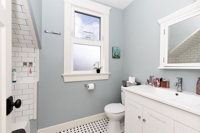 Bathroom with baseboards, toilet, and vanity | Image 18