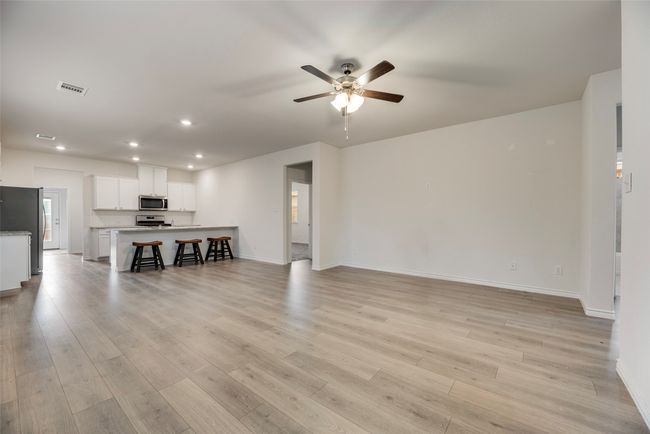 Living area featuring ceiling fan, recessed lighting, baseboards, and light wood finished floors | Image 12