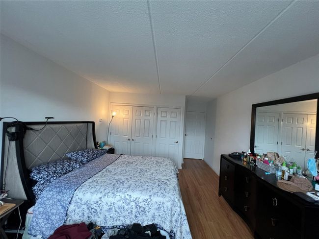 Bedroom featuring wood finished floors | Image 14