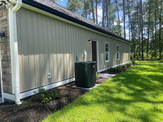 View of side of property with a yard and a shingled roof | Image 5
