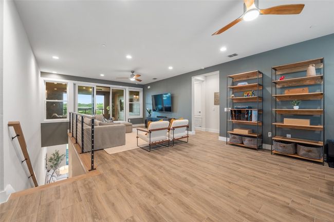 This expansive family room is versatile, functional and elegant featuring a wall of windows overlooking Shoal Creek Greenbelt! | Image 15