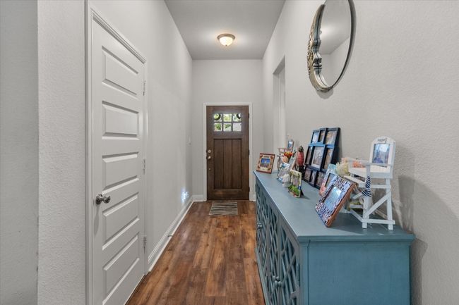 Foyer entrance with dark wood-style floors and baseboards | Image 4