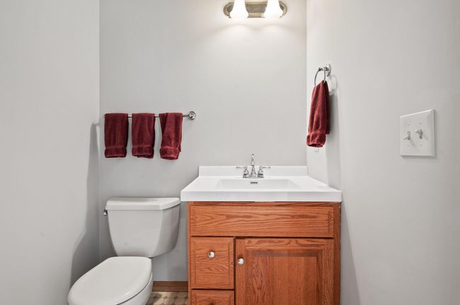There is a guest bathroom on the main level that has been freshly painted and includes a new vanity top and faucet. | Image 17