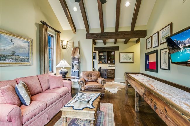 Living area with dark wood-style flooring and beamed ceiling | Image 35