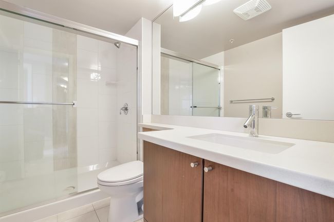 Full bath with a stall shower, vanity, and tile patterned floors | Image 23