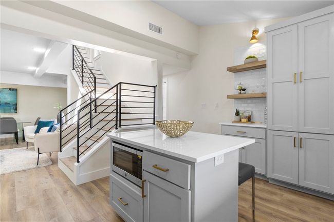 Notice the timeless subway tile backsplash and beautiful open shelves! | Image 16