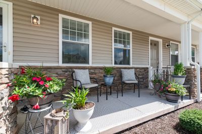 Inviting, covered front porch perfect for relaxing | Image 2