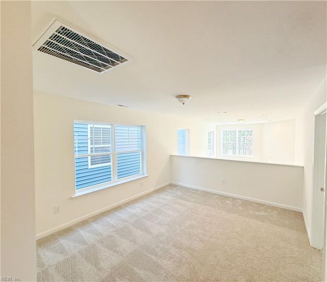 Loft overlooking the family room and a full hall bath complete the second floor. | Image 16