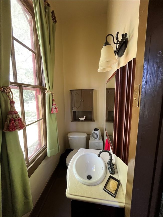 Bathroom featuring toilet and vanity | Image 25