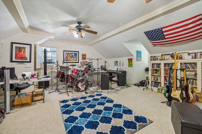 Charming two-story home with a welcoming front porch, nestled among mature trees. Features dormer windows, a classic gable roof, and a spacious yard, perfect for enjoying nature and outdoor activities. | Image 13
