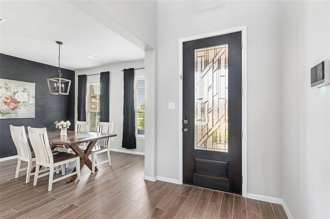 View looking back at the front door and into the dining room | Image 6