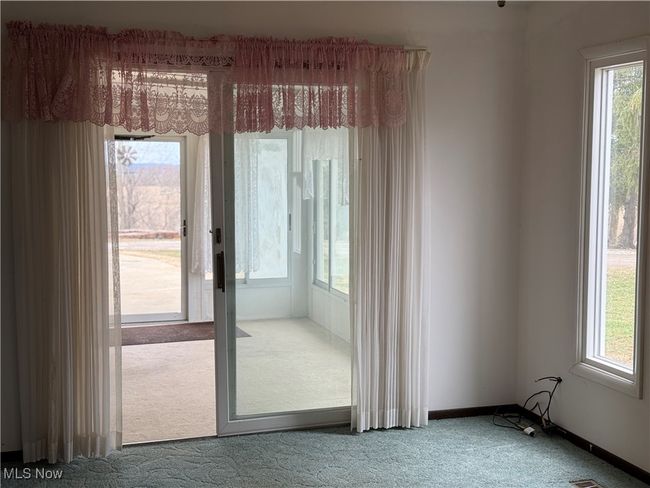 Entryway with carpet, plenty of natural light, and baseboards | Image 20