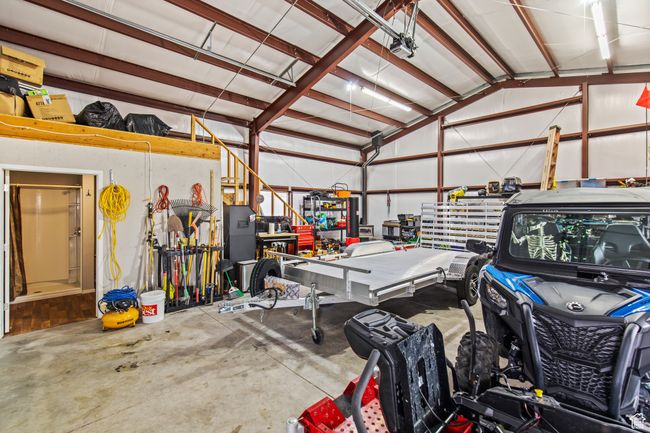 Garage with a workshop area | Image 15