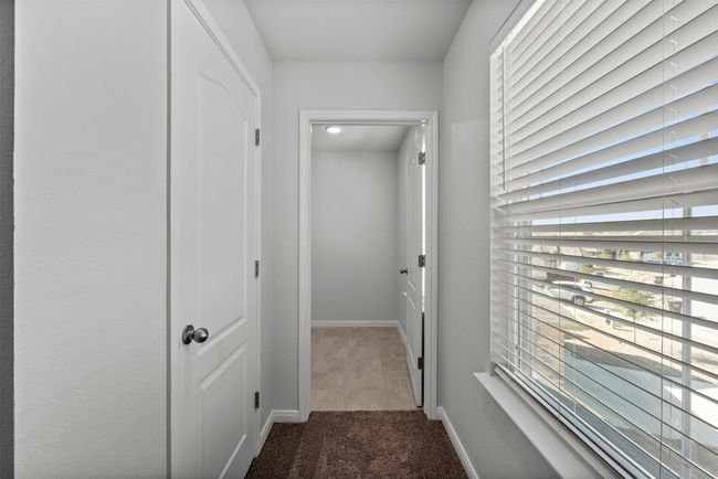 Hallway with carpet and baseboards | Image 18