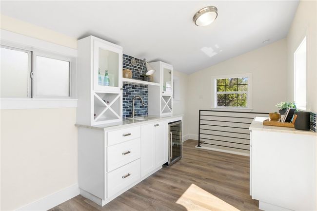 The third-floor loft opens to the rooftop terrace and offers an awesome wet bar and beverage refrigerator. | Image 25