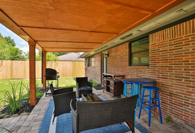 The custom pavers & details make outdoors even better | Image 32