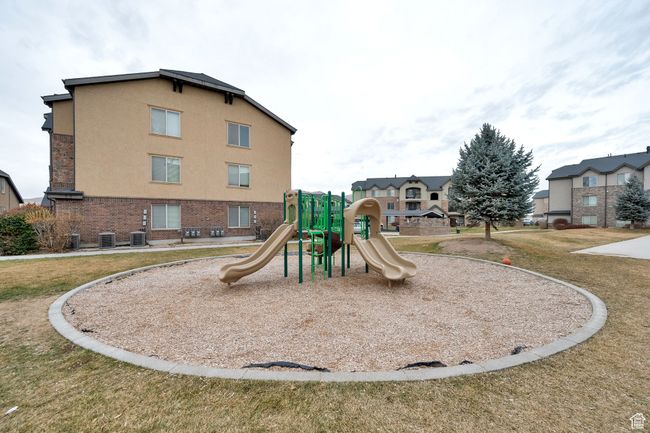 Community playground featuring a lawn | Image 19