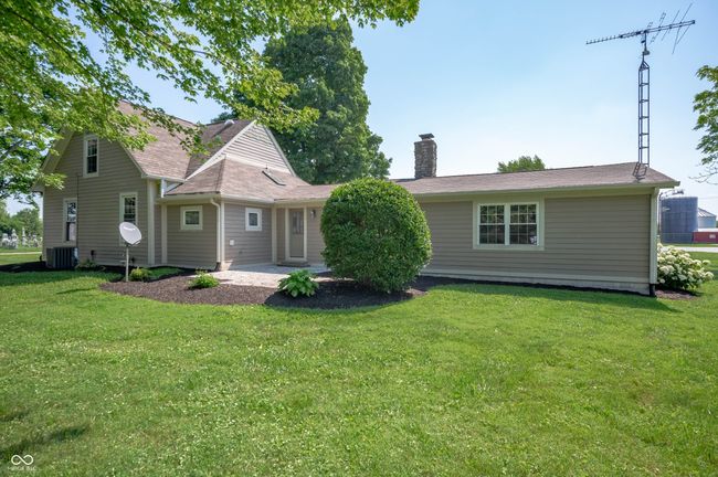 Private patio on west side of house facing pine trees. | Image 11