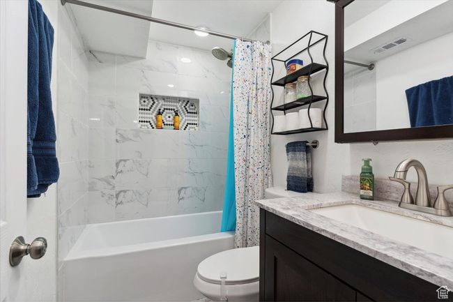 Full bathroom with vanity and shower / bath combo | Image 24