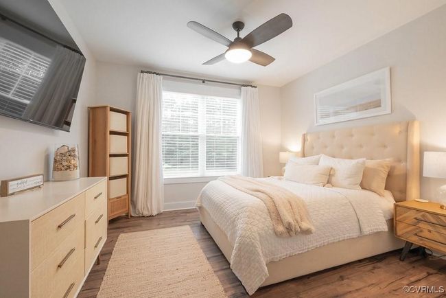 Bedroom featuring wood finished floors and a ceiling fan | Image 8