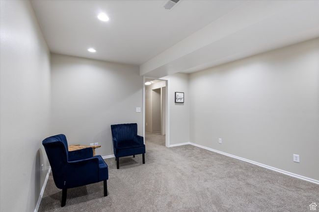 Living area with visible vents, recessed lighting, baseboards, and carpet | Image 22
