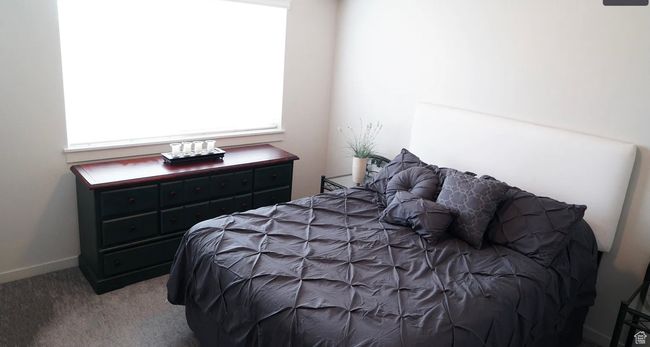 Carpeted bedroom with baseboards | Image 4